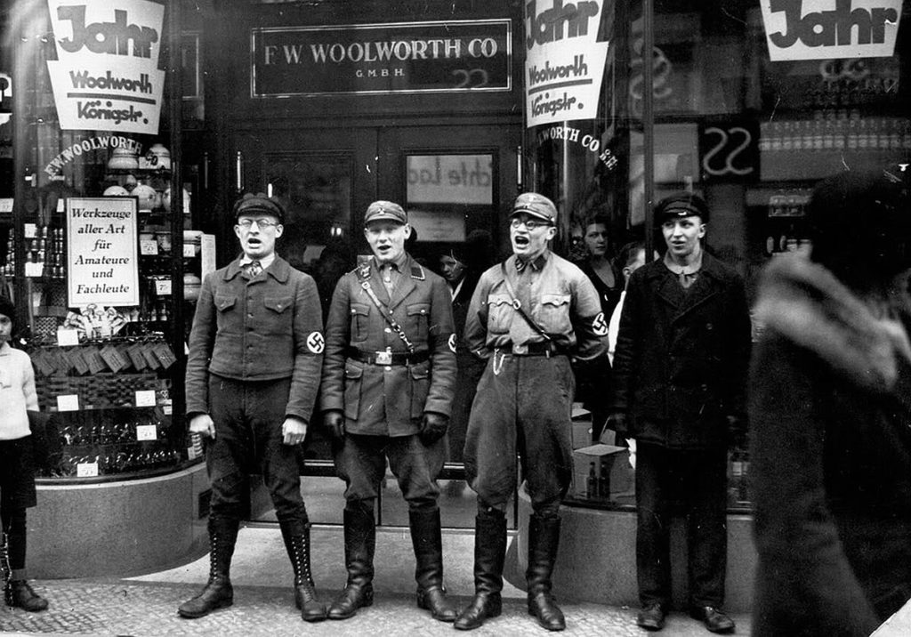 Nazis-singing-to-encourage-a-boycott-of-the-allegedly-Jewish-founded-Woolworths-1933-1024x716.jpeg
