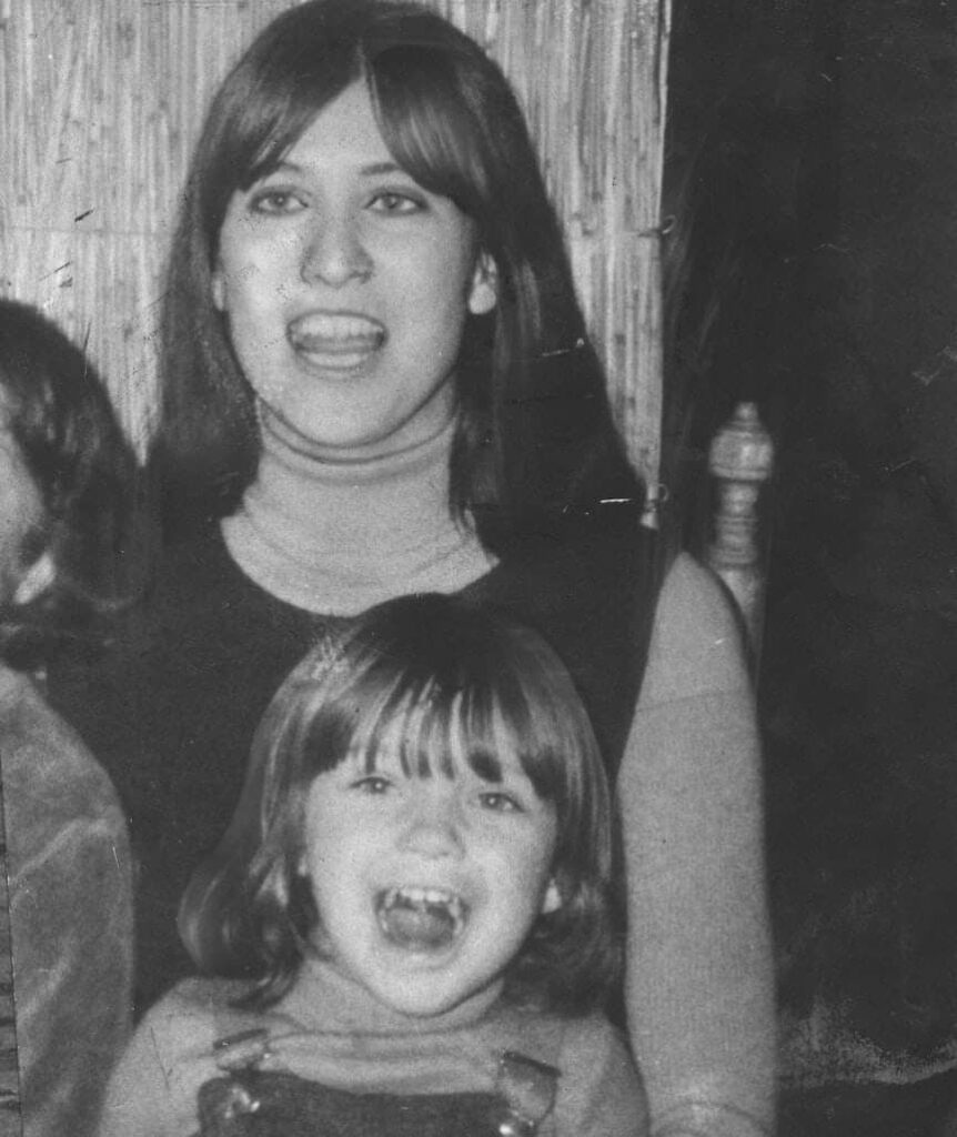 Marianne with a young Anna on her lap.