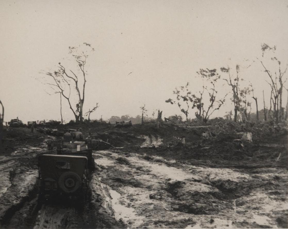 Jeeps bogged to their axles in deep mud on a track
