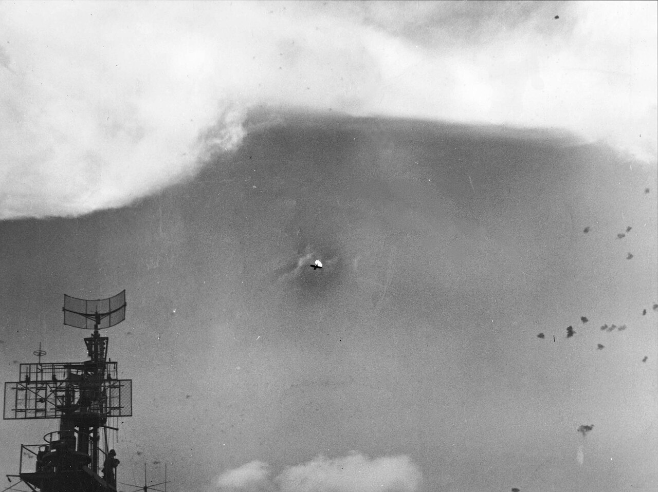 A Japanese aircraft trailing smoke as it falls above an American task force