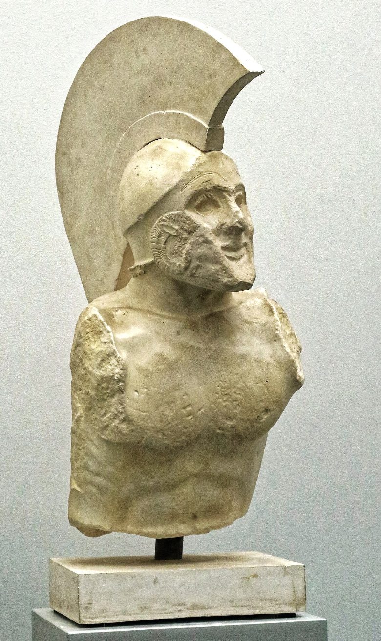 An early classical marble torso of a helmeted warrior in a crested Corinthian helmet and cuirass, conventionally identified as Leonidas